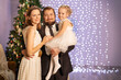 © Evgenia Tiplyashina - christmas family near christmas tree