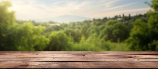 Leinwandbilder - A wooden table with a blank surface is placed against a blurry natural background. This space can be