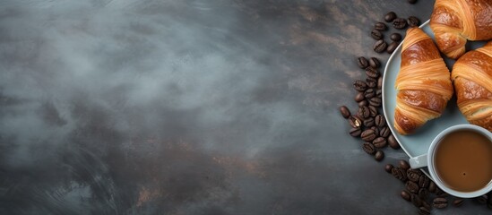 Poster - Fresh croissants and coffee placed on a stone table as seen from above, with empty space for adding