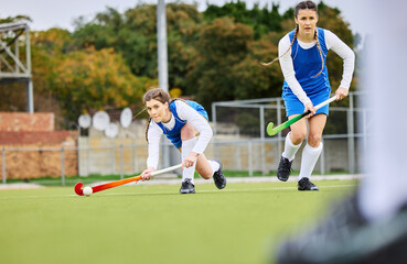 Sticker - Fitness, workout and female hockey players training for a game, match or tournament on an outdoor field. Sports, exercise and young women playing at practice with a stick and ball on pitch at stadium