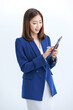 © Bangkok Click Studio - Isolated cutout studio shot Asian beautiful professional successful female businesswoman employee in formal business suit wear standing smiling using touchscreen tablet computer on white background