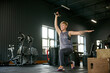 © master1305 - Full- body workout. Beautiful, middle-aged woman with fit body training in gym, doing exercises with dumbbells. Concept of active, sportive and healthy lifestyle, fitness, body care, ad