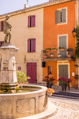 Beautiful scenic old ancient white colorful houses buildings window shutters and wooden doors flowers. Popular tourist vacation destination, Mediterranean village architecture. 