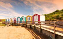 Beach Huts. Colourful Beach Huts Captured During Golden Hour. 