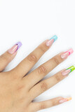 Fototapeta Tulipany - Colorful nails art on the woman hand above white background