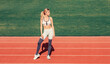 © Yevhen - Woman on stadium track. Sportswoman wearing sportswear. Sportswoman in sportswear. Sportswoman exercising in sport clothing, training, workout