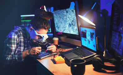 Woman, computer technician and motherboard with circuit, electronics or soldering iron with goggles in lab. Information technology, maintenance and programming for future, hardware or system in night