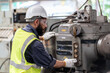 © iammotos - Arabic engineer man repair machine in steel metal manufacturing factory plant industry. technician worker maintenance check quality machine.