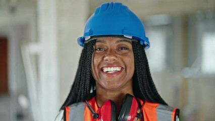 Wall Mural - African american woman builder smiling confident standing at construction site