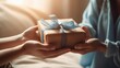 Person hand giving the gift with blur background 