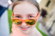 © Анна Молько - portrait of a girl in orange glasses. selective focus