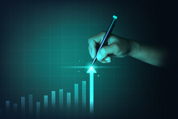 hand holding a pent pointing at highest level point of  business investment graph.