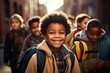 © RPL-Studio - Happy cute black schoolkid with his friends.