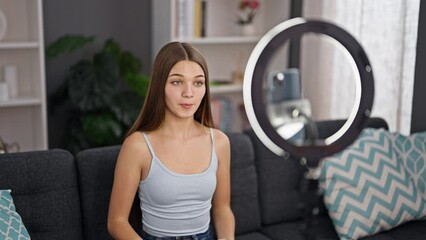 Sticker - Young beautiful girl smiling confident recording video tutorial speaking at home