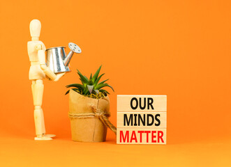 Our minds matter ourmindsmatter symbol. Concept words Our minds matter on wooden block. Beautiful orange table orange background. Businessman model. Our minds matter ourmindsmatter concept. Copy space