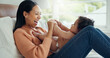 © SneakyPeakPoints/peopleimages.com - Relax, smile and mother with baby on bed for playful, love and free time. Happiness, care and health with woman and newborn infant in bedroom for family home for support, excited and youth