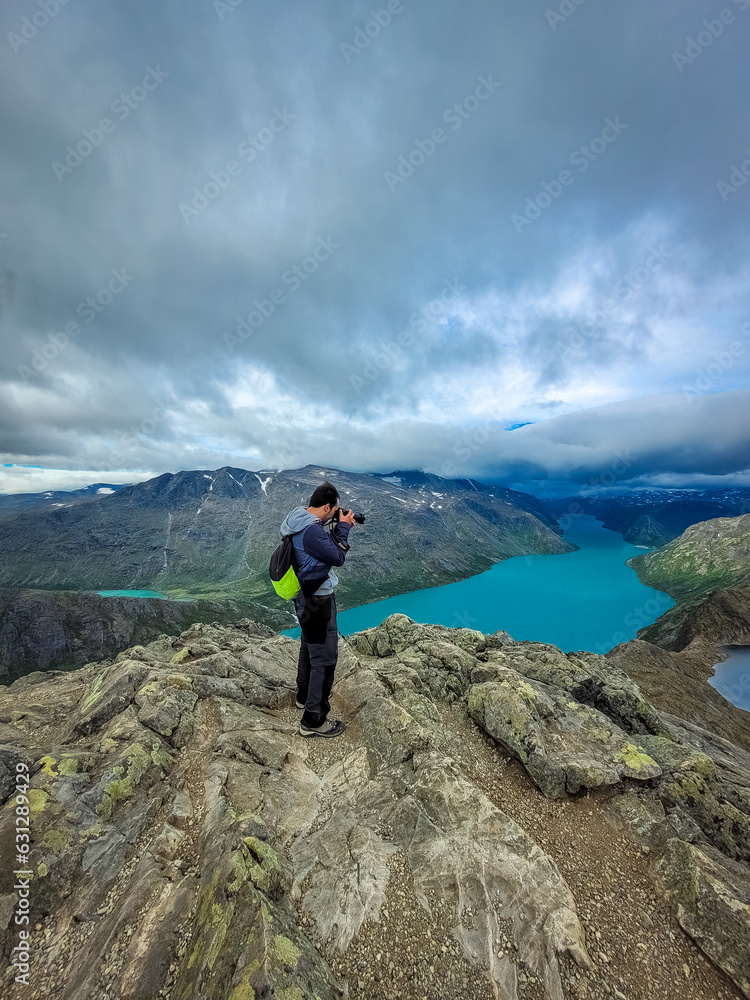 Photographer admiring the amazing view of the Besseggen ridge, famous ...