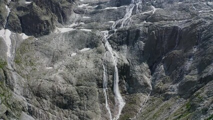 Wall Mural - aerial view of the waterfalls produced by the Adamello glacier in Trentino