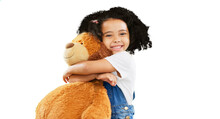 Happy, Little Girl And Hugging Teddy Bear With Smile Isolated On A Transparent PNG Background. Portrait Of Cute, Innocent And Adorable Child Or Kid Holding Or Cuddling Soft Toy In Joyful Happiness