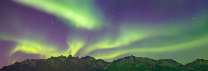 Wall Mural - northern lights (aurora borealis) in the sky over tromso, norway - aurora reflection on the sea on t