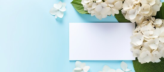 Aufkleber - A top-down view of a beautiful composition featuring hortensia flowers and a blank card on a light