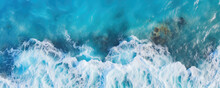 Sea Waves Or Ocean Surface From Aerial View. Blue Water With Foam, Copy Space For Text.