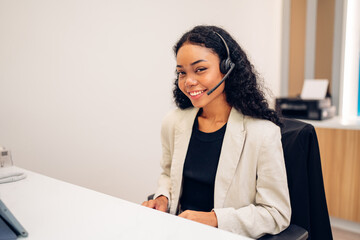 friendly smiling woman call center operator with headset using computer, customer service, call cent