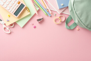 Sticker - Girly elementary school tools layout. Top view of stylish sage backpack, pens, pencils, scissors, calculator, and other stationery arranged on pastel pink background with space for text or promotion