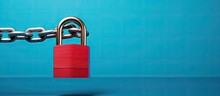 Safety Concept: A Red Chain And Padlock On A Blue Background Symbolize Safety.
