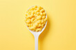 Delicious mac&cheese in spoon isolated on flat orange background with copy space, Mac and cheese 
 macaroni banner template. Top view