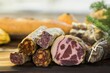 Closeup shot of various uncut deli meats on a wooden board