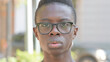 © stockbakers - Close up of Serious Young African Man Face Outdoor