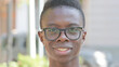 © stockbakers - Close up of Smiling Young African Man Face Outdoor