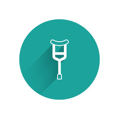 Sticker - White Crutch or crutches icon isolated with long shadow background. Equipment for rehabilitation of people with diseases of musculoskeletal system. Green circle button. Vector