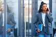© Valerii Apetroaiei - Business woman at the entrance to an office building