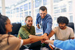 © Valerii Apetroaiei - A group of young freelancers working in a coworking space