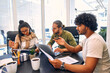© Valerii Apetroaiei - A group of young freelancers working in a coworking space