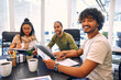 © Valerii Apetroaiei - A group of young freelancers working in a coworking space