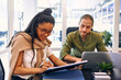 © Valerii Apetroaiei - A group of young freelancers working in a coworking space