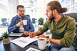 © Valerii Apetroaiei - A group of young freelancers working in a coworking space