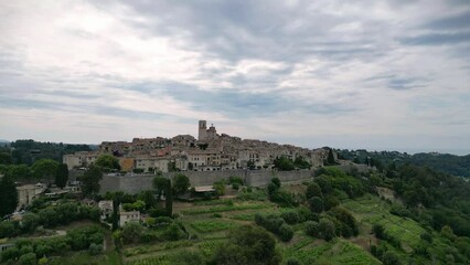 Poster - Drone footage of Saint paul de vence cityscape with green hills in France