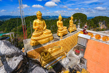 Trio Of Golden Buddha Statues In Several Postures At The Hilltop Pagoda Of The Wat Tham Suea Aka Tiger Cave Temple Of Krabi In The South Of Thailand