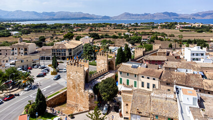 Wall Mural - Aerial view of the gate of San Sebastian in the walls of the medieval city of Alcudia on the Balearic island of Majorca (Spain) in the Mediterranean Sea