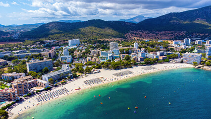 Wall Mural - Aerial view of Es Carregador, the beach of Palmanova in Magaluf, a seaside resort town on Majorca in the Balearic Islands, Spain