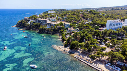 Wall Mural - Aerial view of the shore of Sa Cisterna in Magaluf, a seaside resort town on Majorca in the Balearic Islands, Spain