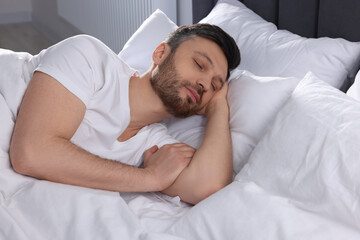 Sticker - Handsome man sleeping in soft bed at home