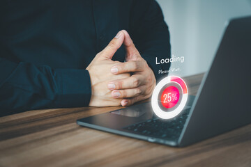 Adult man using a laptop computer for download and update software and waiting to loading digital file data form website, very slow internet form wifi. Concept of waiting for load of loading symbol.