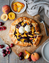 Overhead View Of Fresh Peach And Cherry Galette With Ice Cream.