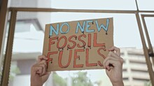 Demonstrator Protesting Against Development Of New Fossil Fuels.