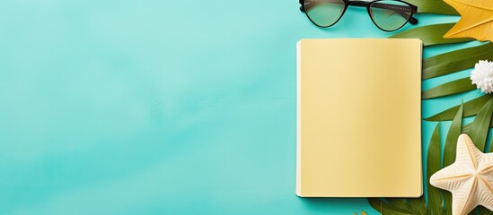 Poster - A writing book with summer beach accessories on a background, space for writing. Flat layout with room for text.
